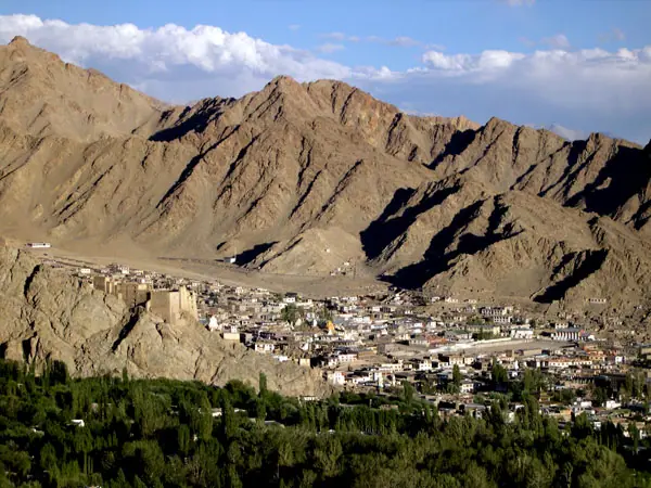Leh town below barren mountain slopes